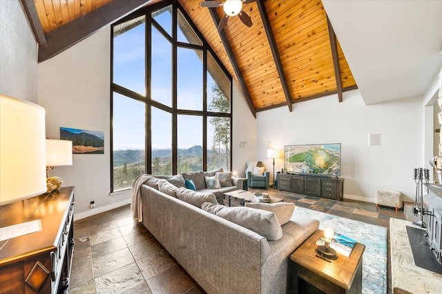 living room with wood ceiling, ceiling fan, beam ceiling, and high vaulted ceiling