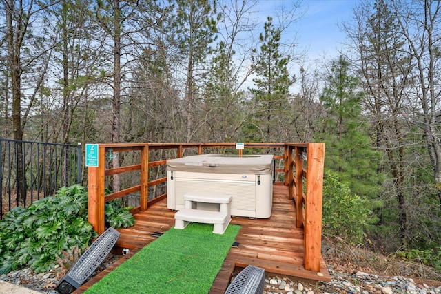 wooden terrace with a hot tub