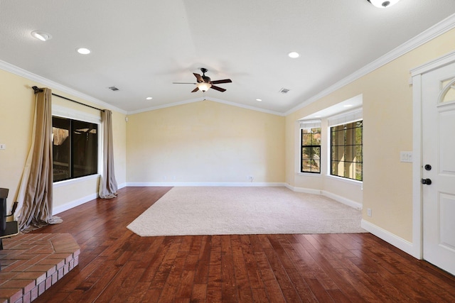 interior space featuring ornamental molding, lofted ceiling, and dark hardwood / wood-style flooring