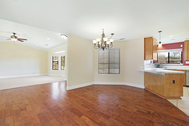 kitchen featuring dark hardwood / wood-style floors, tile countertops, and decorative light fixtures