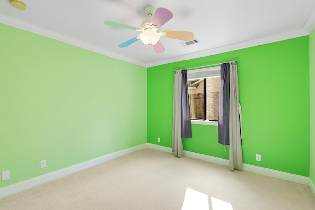 carpeted empty room with crown molding and ceiling fan