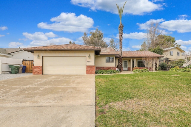 view of front of house featuring a garage and a front yard