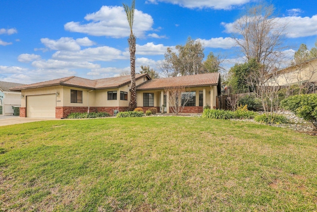 view of front of property featuring a garage and a front yard