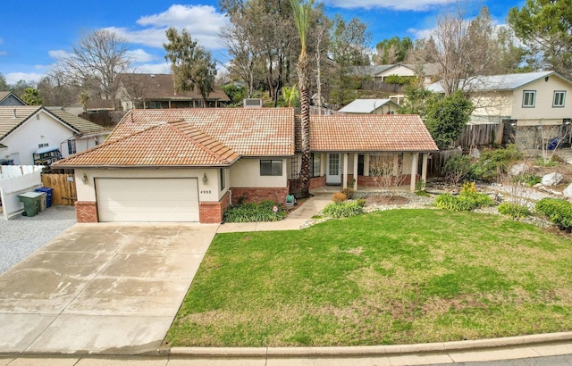 view of front of home with a garage and a front lawn