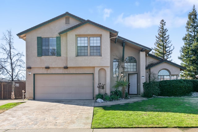 view of front of property featuring a garage and a front lawn