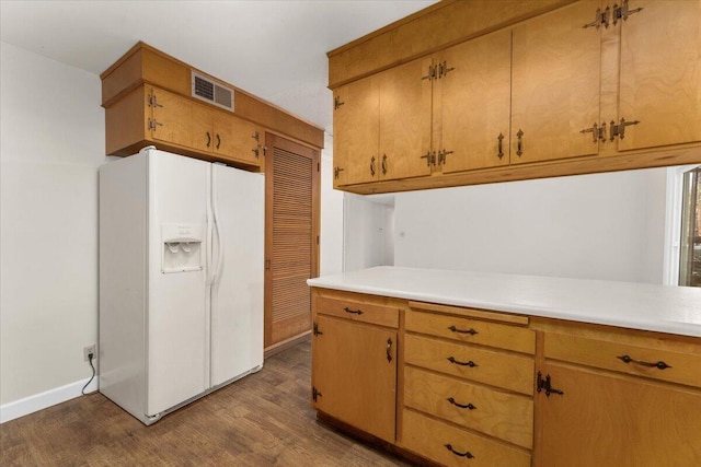 kitchen with white refrigerator with ice dispenser and dark hardwood / wood-style floors