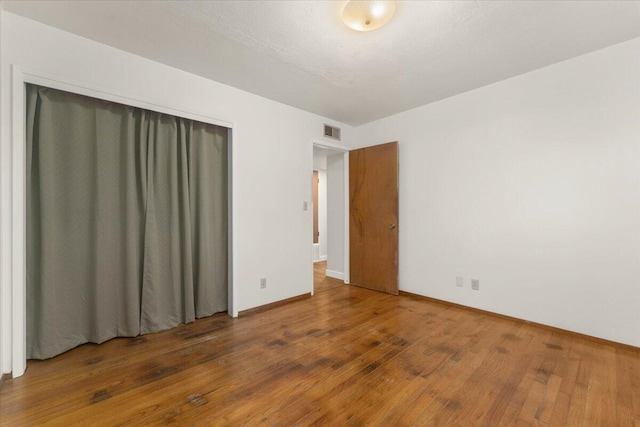 spare room featuring dark hardwood / wood-style floors