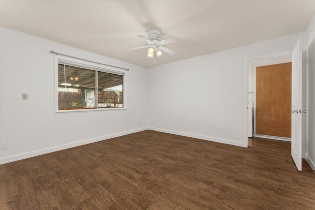 spare room featuring dark hardwood / wood-style floors and ceiling fan