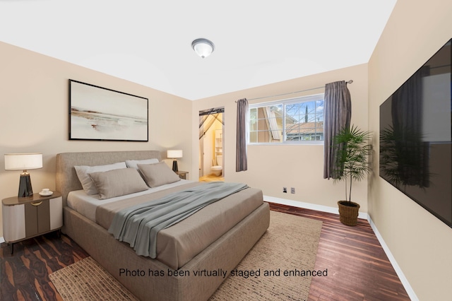 bedroom featuring dark wood-style flooring and baseboards