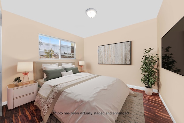 bedroom featuring dark wood-style floors and baseboards