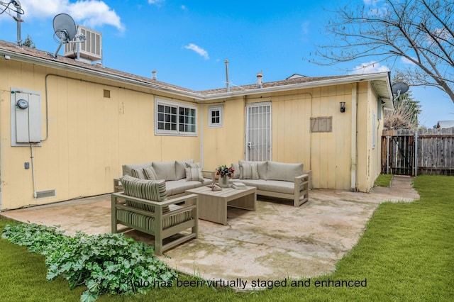 rear view of house featuring central AC unit, fence, a yard, a patio area, and an outdoor living space