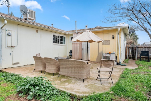 rear view of property featuring crawl space, fence, and a patio