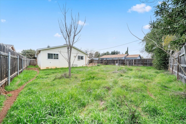 view of yard featuring a fenced backyard