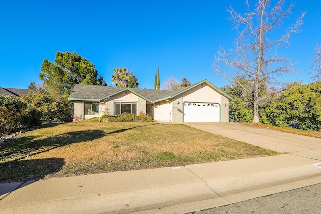 ranch-style house featuring an attached garage, brick siding, driveway, and a front yard