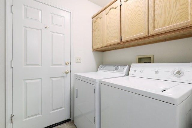 laundry area with cabinet space and washing machine and clothes dryer