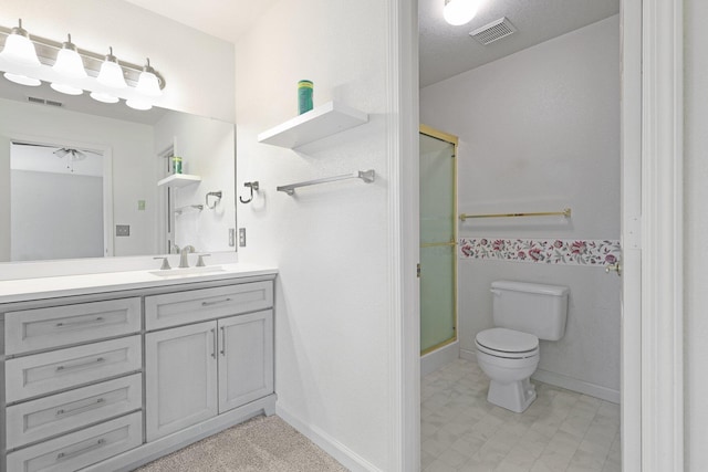 full bath featuring toilet, a stall shower, vanity, and visible vents