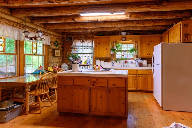 31 Lake Rd, Junction City, CA 96048 - kitchen with beamed ceiling, light wood-type flooring, log walls, and white appliances