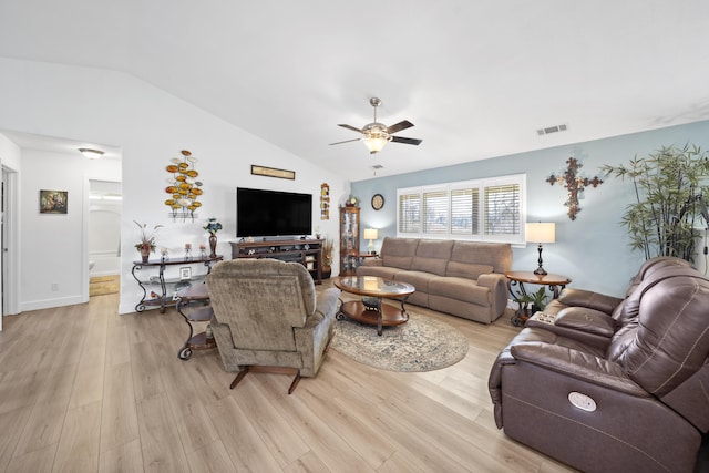 living area featuring lofted ceiling, ceiling fan, light wood-type flooring, and visible vents