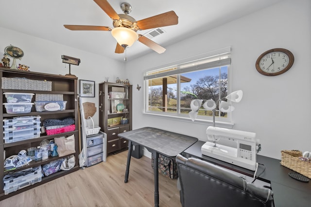 office area with ceiling fan and light wood-type flooring