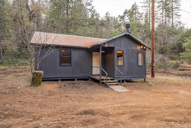 rustic home with metal roof