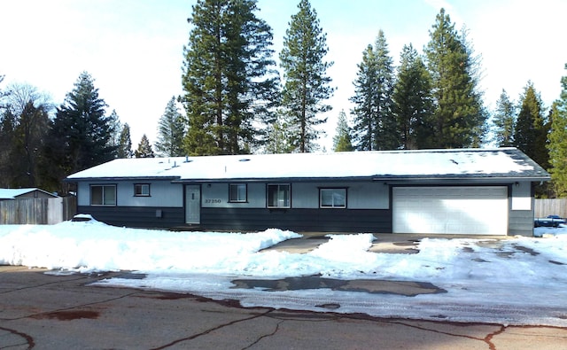 single story home featuring a garage