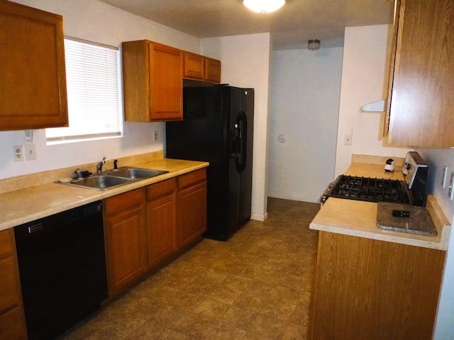 kitchen featuring sink and black appliances