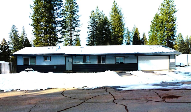 ranch-style house featuring a garage