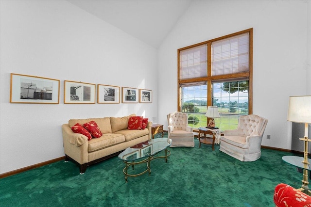 carpeted living room with high vaulted ceiling