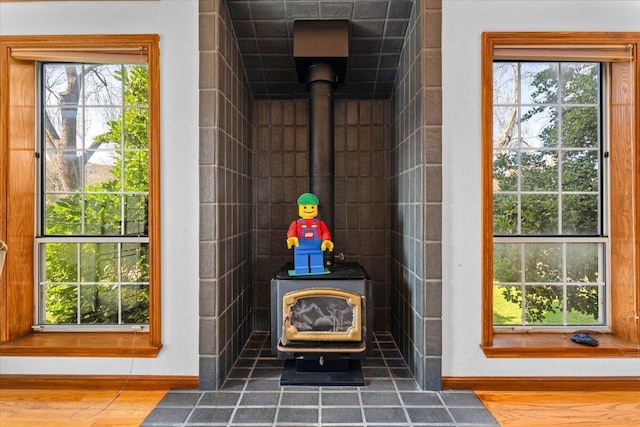 interior space featuring hardwood / wood-style floors and a wood stove