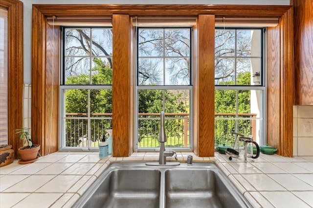 interior details with sink and tile countertops