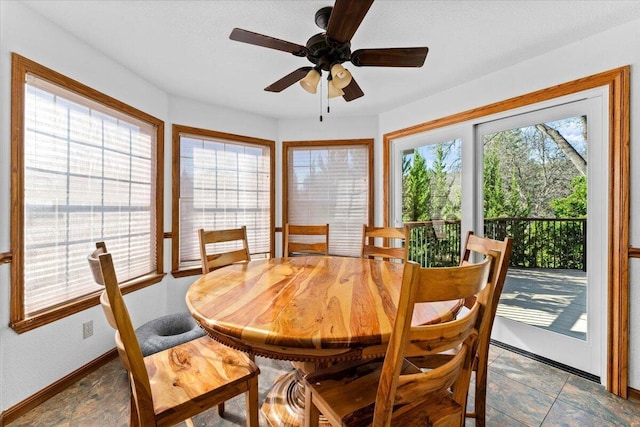 dining space with ceiling fan