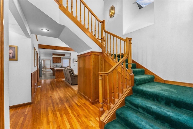 stairs featuring wood-type flooring