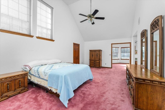 carpeted bedroom with high vaulted ceiling and ceiling fan