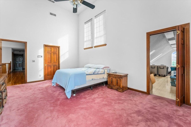 bedroom with high vaulted ceiling, ceiling fan, and carpet