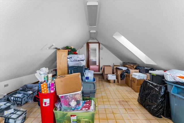 attic featuring a skylight