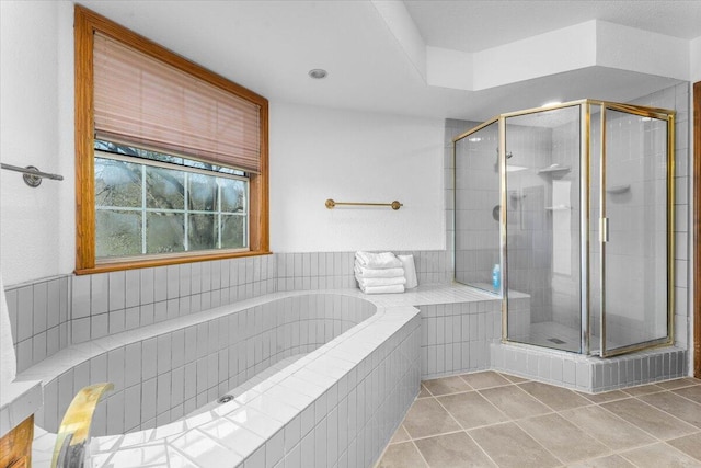 bathroom with tile patterned flooring and plus walk in shower