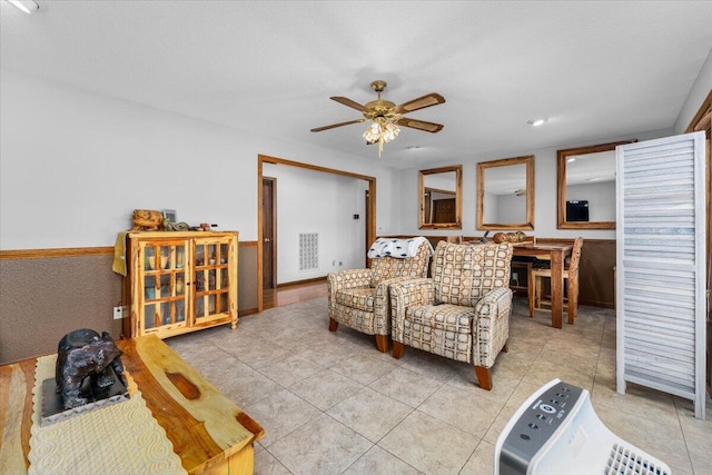 living room with light tile patterned flooring and ceiling fan