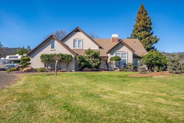 view of front of property with a front lawn