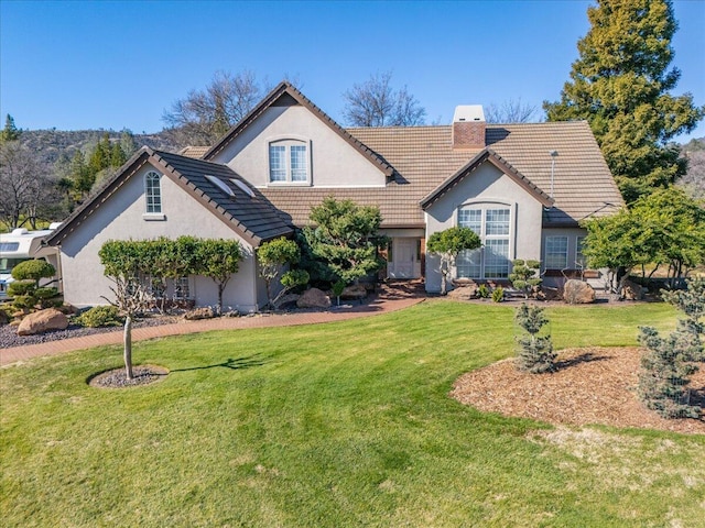 view of front of property with a front lawn