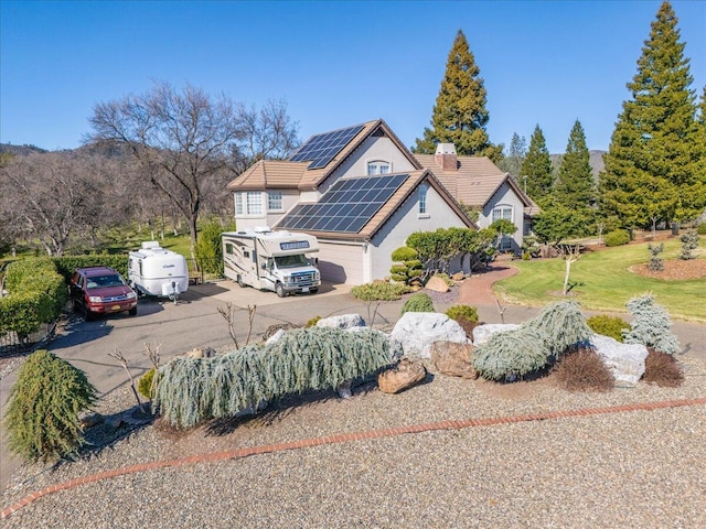 view of front of house featuring solar panels