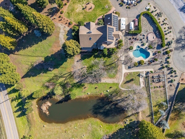 birds eye view of property with a water view