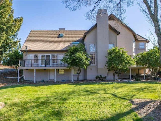 back of house with a yard