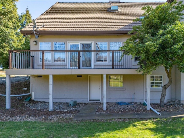 rear view of property with a deck