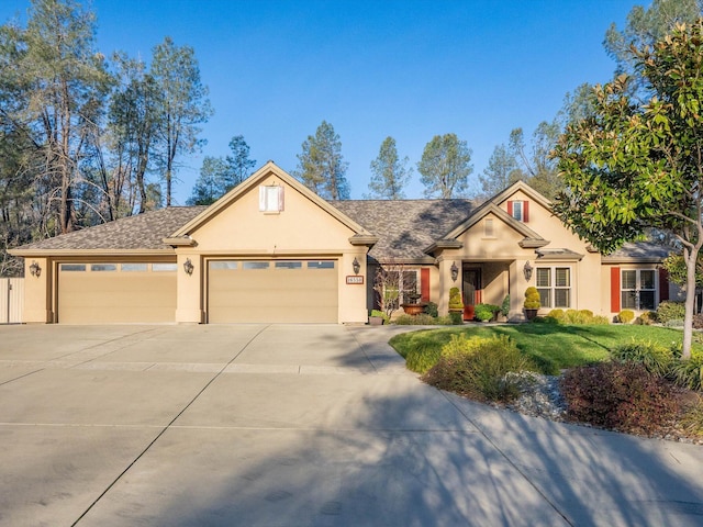 view of front of house featuring a garage and a front yard