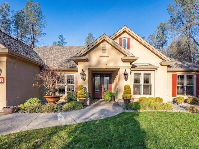 view of front facade featuring french doors and a front yard