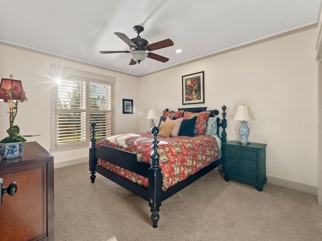 bedroom with light carpet, crown molding, and ceiling fan