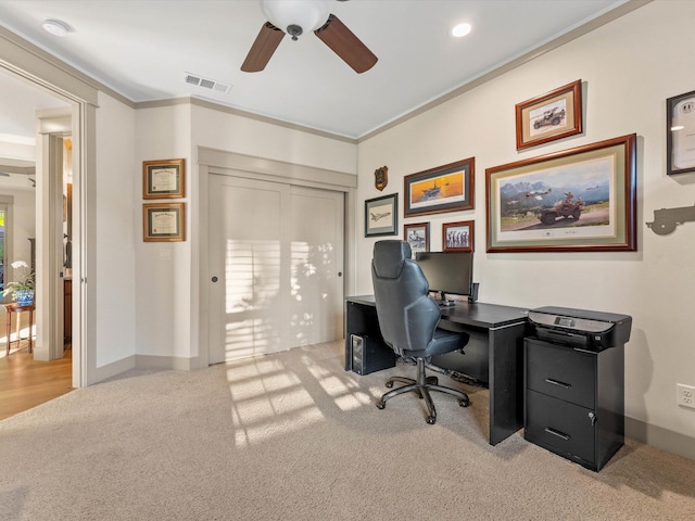 office with ornamental molding, light carpet, and ceiling fan