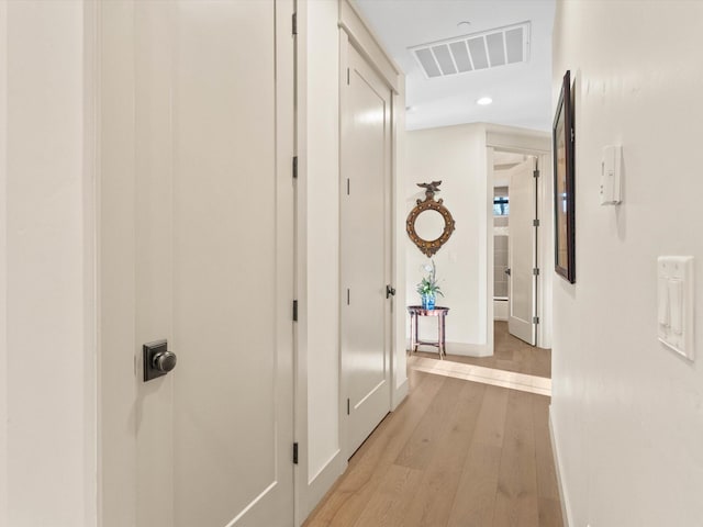 hall with light wood-type flooring