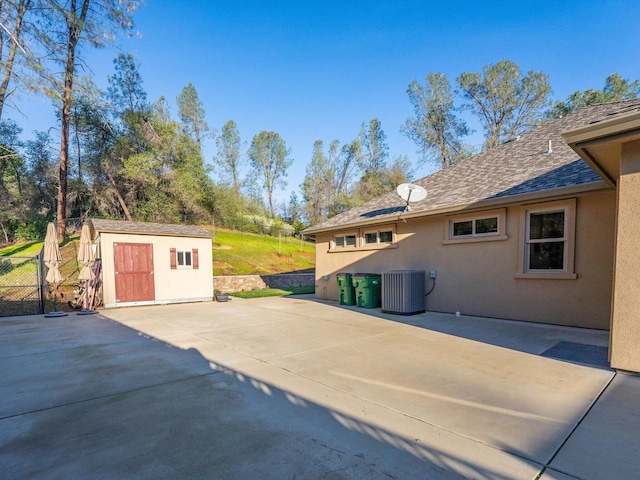 exterior space featuring central AC and a storage unit