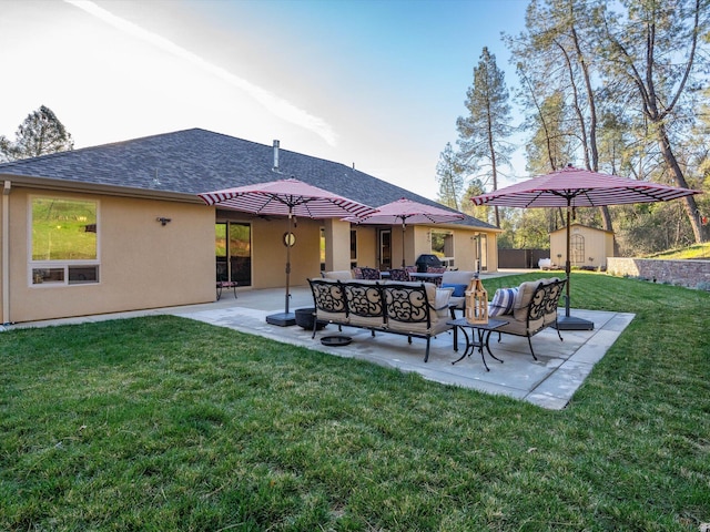 rear view of property with a storage shed, a patio, outdoor lounge area, and a lawn